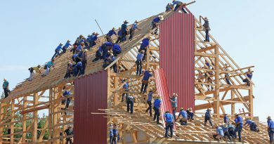 people building structure during daytime