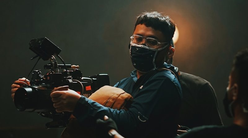 man in black shirt wearing black goggles