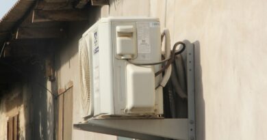 a white phone mounted to the side of a building