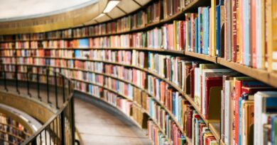 books on brown wooden shelf