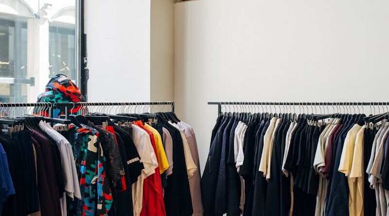 assorted-color clothes hanging on metal racks