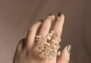 person with white flower on hand
