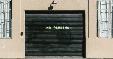 black metal roll-up door with no parking print